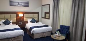 Кровать или кровати в номере هبي نيس للوحدات السكنية