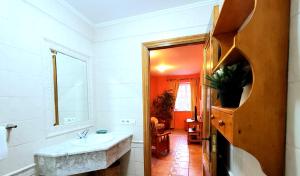 Ванная комната в Apartamentos Turísticos Rosa +27 фотографий
