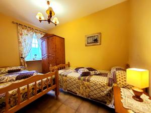 Кровать или кровати в номере Apartamentos Turísticos Rosa