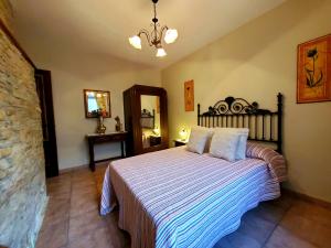 Кровать или кровати в номере Apartamentos Turísticos Rosa