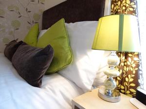 A bed or beds in a room at Adelphi Guest House 