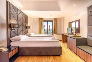 Letto o letti in una camera di Tino Hotel & SPA