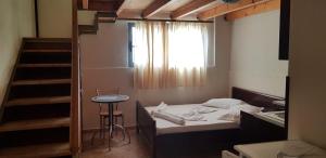 Postel nebo postele na pokoji v ubytování The First Hotel Saranda
