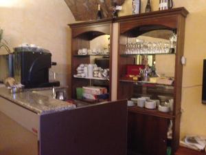 a kitchen with a counter and a person in a mirror at Hotel Filippeschi in Orvieto