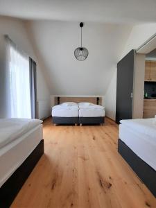 Postel nebo postele na pokoji v ubytování Apartmány Resort Na Horské