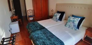 Ein Bett oder Betten in einem Zimmer der Unterkunft Blue Bamboo Hotel - Duna Parque Resorts & Hotels