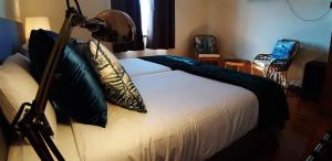 Ein Bett oder Betten in einem Zimmer der Unterkunft Blue Bamboo Hotel - Duna Parque Resorts & Hotels