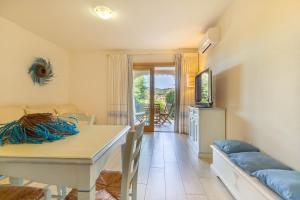 Postel nebo postele na pokoji v ubytování Pavoncelle - Appartamento a Villasimius con giardino privato a pochi passi dal mare