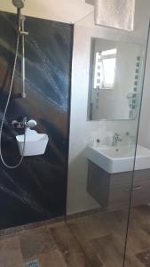 a bathroom with a sink and a mirror at Blue Border in Vama Veche +34 photos