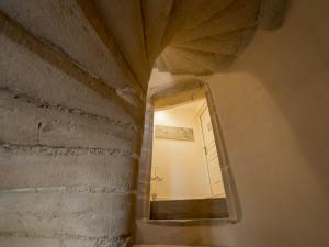 a mirror hanging on a wall in a room at Le Cara Sehiah 1D in Beaune