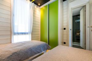 Säng eller sängar i ett rum på Living Point Mobile Homes