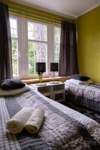 Posteľ alebo postele v izbe v ubytovaní Apartament Nectar Pond