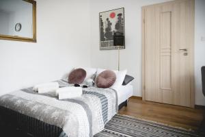 Posteľ alebo postele v izbe v ubytovaní Apartament Nectar Pond