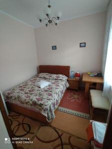 Кровать или кровати в номере Sadyba Margaryta