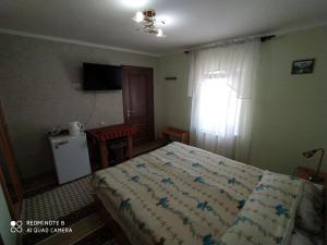 Sadyba Margaryta tesisinde bir odada yatak veya yataklar