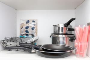 a kitchen counter with a frying pan and a mixer at City Center Main Square Apartments Zagreb in Zagreb