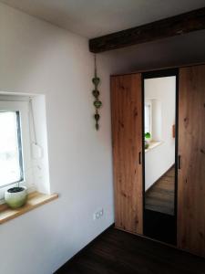 a room with a wooden door and a window at Ferienwohnung Jubiläumsgrat in Grainau