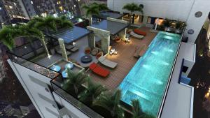 an overhead view of a swimming pool on a building at Time Home Service 1411 in Maceió