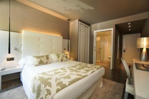 Кровать или кровати в номере Hotel & Spa Xalet Bringue