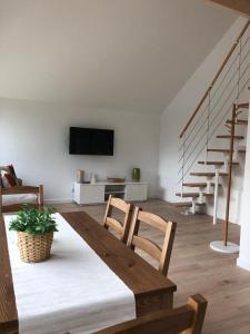 TV a/nebo společenská místnost v ubytování Morskie Wzgórze Apartamenty + 31 fotografií