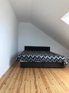 Postel nebo postele na pokoji v ubytování Morskie Wzgórze Apartamenty