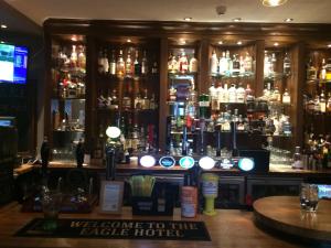 a bar with a lot of bottles of alcohol at Eagle Hotel in Dornoch