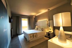 Кровать или кровати в номере Hotel & Spa Xalet Bringue