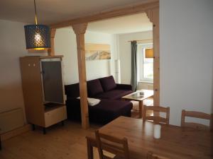 a living room with a couch and a table at Apartments Sonne am Sund in Stralsund