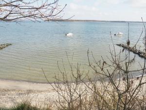 a view of a beach with boats in the water at Apartments Sonne am Sund in Stralsund