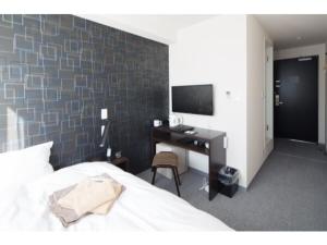 Un pat sau paturi într-o cameră la C-style inn SOMA 34 - Vacation STAY 87845