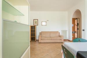 A bed or beds in a room at Hotel Ristorante al Gabbiano