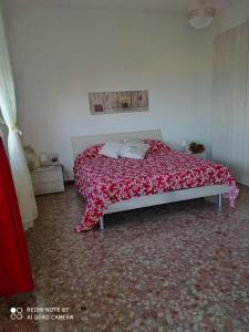 Giường trong phòng chung tại Terrazza del Poggio