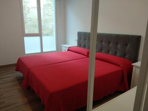 Albergue & Rooms Murgadán客房内的一张或多张床位