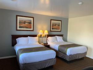 מיטה או מיטות בחדר ב-Relax Inn