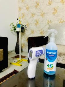 a bottle of detergent and a hair dryer on a table at Royal Heritage Villa Udaipur in Udaipur