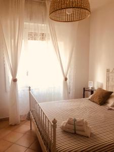 Posteľ alebo postele v izbe v ubytovaní Caio Asinio Apartment