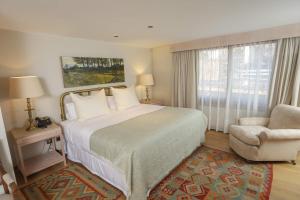 מיטה או מיטות בחדר ב-Leonera Hotel
