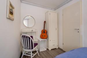 Postel nebo postele na pokoji v ubytování Apartments Kaštel