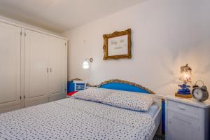 Postel nebo postele na pokoji v ubytování Apartments Kaštel