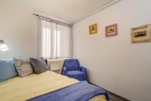 Postel nebo postele na pokoji v ubytování Apartments Kaštel