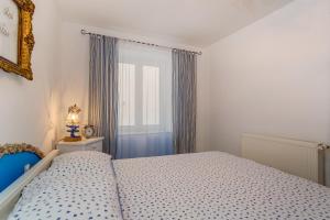 Postel nebo postele na pokoji v ubytování Apartments Kaštel