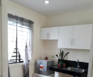 a kitchen with a sink and a window at Rent! Monthly or More in San Juan