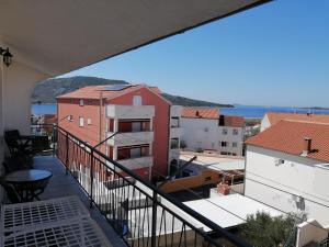 a balcony with a view of a city at Goga Apartments in Primošten
