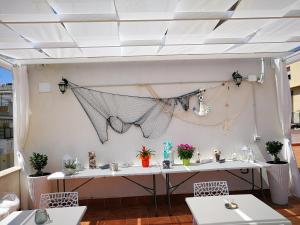 a room with a table and two chairs at B&B Il Mare degli Dei in Letojanni
