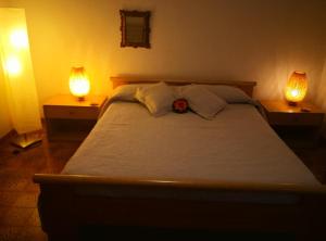 Ένα ή περισσότερα κρεβάτια σε δωμάτιο στο appartamento in villa a Pietragrande