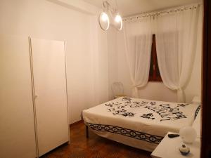 Postel nebo postele na pokoji v ubytování appartamento in villa a Pietragrande Villa Mi Vida