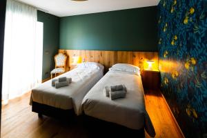 Postel nebo postele na pokoji v ubytování The Lion's Den BnB