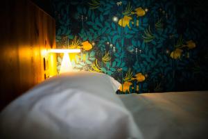 Postel nebo postele na pokoji v ubytování The Lion's Den BnB