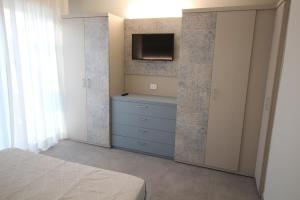 A bed or beds in a room at Persea mare appartamenti