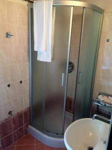 a bathroom with a shower and a sink at Chata Fanynka in Bělá pod Pradědem